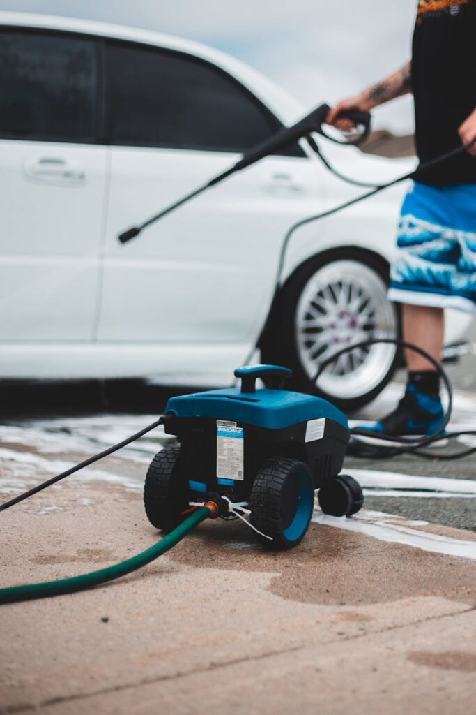 Pressure washer placed on sidewalk